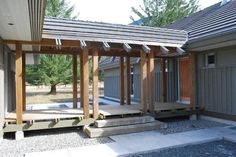 an outdoor covered patio with steps leading up to it