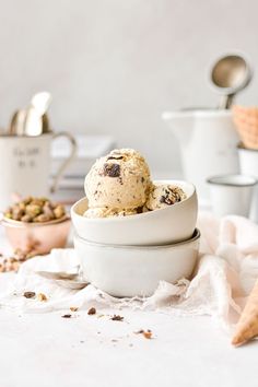 two bowls filled with ice cream on top of a table