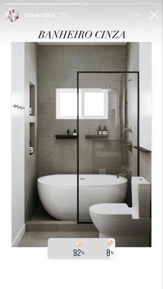 a white bath tub sitting next to a toilet in a bathroom under a light fixture