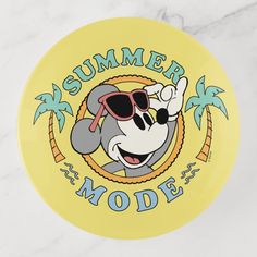 a yellow frisbee with an image of mickey mouse wearing sunglasses and the words summer mode on it