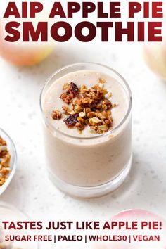 an apple pie smoothie in a glass with granola toppings on the side