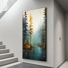 a painting hanging on the wall next to a stair case in a room with white walls