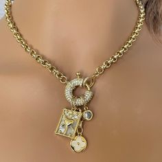 This Equestrian style chain necklace features a CZ mariner clasp with 3 stunning charms. A mother of pearl coat of arms, a mother of pearl clover and a large cubic zirconia stone. The chain is  brass,  gold plated and is 8mm wide . It is 18k electroplated for a high quality finish.  Perfect for  layering with other necklaces. Tips to keep your jewelry looking good. 1) Keep jewelry away from water and chemicals. 2) Remove during physical activities. 3) Store separately in a soft pouch or airtight box. 4) Avoid wearing to bed. 5) Gently polish with a soft, lint-free cloth to clean. FAST SHIPPING PACKAGING 🎁 All items come beautifully packaged in their own pouch or box. Gift messages are included. ❤️Thank you for stopping by. Please feel free to contact me if you have any questions Clean Fast, Hand Knotted Necklace, Shipping Packaging, Gold Necklace Designs, Brand Jewelry, Special Jewelry, Brass Gold, Rolo Chain, Equestrian Style