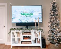 the christmas tree is in front of the television