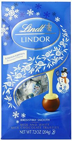 lindil lindor milk chocolate bar with frosting on the top and snowflakes around it