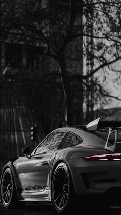 a black and white photo of a sports car