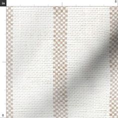 a white and brown checkered pattern on fabric