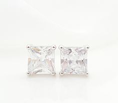 "These CZ stud earrings are made with 9.5mm square cubic zirconia stones, set in rhodium bezels with Sterling silver posts. These big, diamond-like earrings make lovely jewelry gifts for her. Thank you for looking. - Shop Gemsicles, an Etsy boutique with hundreds of sparkly items for weddings, gifts and just because. Our original jewelry designs feature gemstones, Swarovski® crystals, pearls, CZs, vintage components, porcelain & dried flowers, lampwork glass, rhinestones, precious metals and Square Cut Cubic Zirconia Earrings For Wedding, Square Cut Cubic Zirconia Wedding Earrings, Diamond White Rectangular Earrings For Wedding, Diamond White Rectangular Wedding Earrings, Wedding Diamond White Rectangular Earrings, Classic Rectangular Cubic Zirconia Earrings, Brilliant Cut Cubic Zirconia Rectangular Earrings, Diamond White Square Cut Earrings For Wedding, Square Cut White Gold Earrings For Wedding