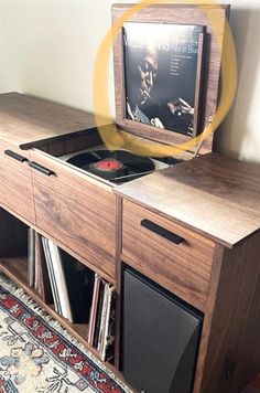 a wooden entertainment center with an old record player