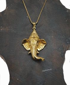 HANDMADE Statement unique Ganesh necklace. Known to Tibetan Buddhist as Ganapati. Believed to be the remover of obstacles, god of the beginnings. Elephants are also traditionally considered a symbol of good luck, wisdom, fertility, and protection. Wearing or placing the image of the elephant with its trunk raised is thought to attract good fortune and positive energy. With beautiful details and Intricate work. Handmade with high quality jewelry brass nickel free. Aprox Lenght of pendant: 6.4 cm Handmade Spiritual Necklaces For Puja, Handmade Spiritual Necklace For Navratri, Spiritual Necklace For Puja And Diwali, Brass Necklace As Diwali Gift, Spiritual Necklace For Diwali Puja, Handmade Spiritual Temple Necklace For Diwali, Brass Necklace For Diwali Gift, Spiritual Engraved Temple Necklace For Rituals, Spiritual Necklaces For Navratri