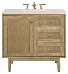 a bathroom vanity with two faucets on each side