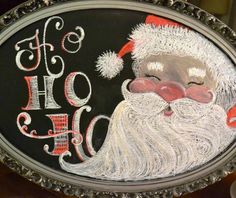 a black and white drawing of santa claus on a metal frame with the word ho ho ho written below it