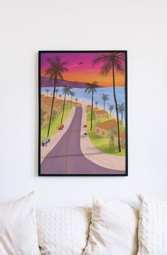 a painting hanging on the wall above a bed in a room with white walls and pillows