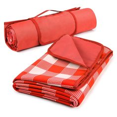 a red and white checkered blanket folded on top of each other