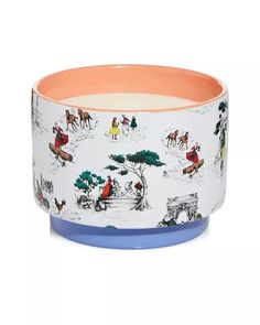 a ceramic bowl with horses and people on it, sitting in front of a white background