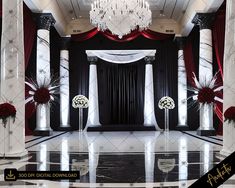 a black and white room with chandelier, red drapes and flowers on the floor