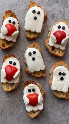 some toasted bread with white frosting and red nose