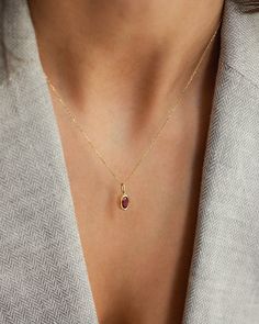 Description Elevate your jewelry collection with our Oval Ruby Pendant Necklace, a timeless piece signed for the woman who appreciates minimalist elegance. The necklace features a captivating oval-cut ruby, securely bezel set in 14k solid gold. With its clean lines and impeccable craftsmanship, this necklace effortlessly enhances any look, from formal to casual. Details * 4x6mm oval cut ruby * 14K solid gold * Chain length: 40cm + 3cm (16" + 1.18") * Ready to ship in 14K yellow gold Processing t Timeless Oval Everyday Necklaces, Refined Oval Jewelry Gift, Timeless Oval Necklace For Everyday, Elegant Birthstone Jewelry In Oval Cabochon, Oval Fine Jewelry Necklace With Cable Chain, Minimalist Oval Gemstone Jewelry, Refined Oval Pendant Necklace As Gift, Elegant Oval Cabochon Birthstone Jewelry, Everyday Oval Bezel Set Jewelry