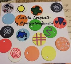 there are many different colored buttons on this card that says, lettia locatella by progettioinnika