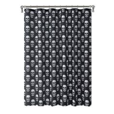 a black and white shower curtain with skulls on it