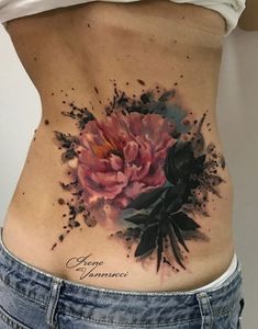 a woman's stomach with flowers on it