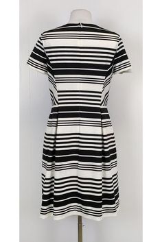 Be bold in stripes with this darling dress! Perfect for day time wear, you can style it with red accessories and chic flats. Size 10 67% polyester, 28% viscose, 5% spandex Made in U.S.A Rounded neckline Short sleeve Back zipper Lined Fitted at waist As is: Undone seam on right sleeve Bust 34.5" Waist 30" Shoulder to hem 37" Chic Striped Dresses For Day Out, Chic Vertical Stripes Dress For Day Out, Chic Striped Lined Midi Dress, Chic Fitted Dress With Contrast Stripes, Fitted Dresses With Vertical Stripes For Work, Chic Fitted Dress With Vertical Stripes, Chic Day Out Dress With Vertical Stripes, Elegant Midi-length Dress With Vertical Stripes, Striped Knee-length Midi Dress For Work