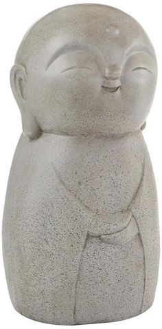 a small statue of a cat with its eyes closed