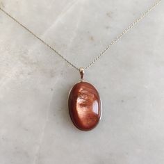 This stunning Pendant is set in 14k Solid Yellow Gold with Natural Sunstone (Feldspar Crystal) with utmost precision. It is a unique gemstone Pendant for nearly every occasion and is completely hassle-free jewelry. ITEM DETAILS: *  GEM: Sunstone * GEM SIZE: 18x27mm * GEM SHAPE: Oval * Gem WEIGHT: 36.83 carats * Gold Purity: 14KT * Gold Weight: 0.75 gram * Total Weight: 8.13 gram The Gold purity is guaranteed and it comes with authentic 14KT gold hallmark. Since my items are handmade, they are absolutely nickel and lead free. CUSTOMIZATION: * Gemstone customization is available and it can be substituted with a gem of your choice. Kindly message me for the same. PACKAGING * The Pendant comes with layers of safe and secure wrapping along with Free handmade jewelry box with every purchase. ➡️H Gold Natural Gemstones In Sterling Silver, Gold Cabochon Gemstones For Formal Occasions, Luxury Gold Oval Cabochon Gemstones, Elegant Oval Polished Gemstones, Polished Yellow Gold Oval Cabochon Gemstones, Yellow Gold Polished Oval Cabochon Gemstones, Elegant Oval Gemstones With Polished Finish, Elegant Gold Gemstones With Polished Finish, Yellow Gold Oval Cabochon Gemstone With Polished Finish