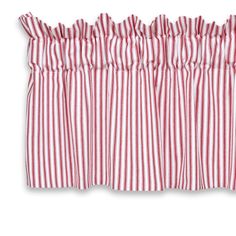 a red and white striped curtain hanging on a window