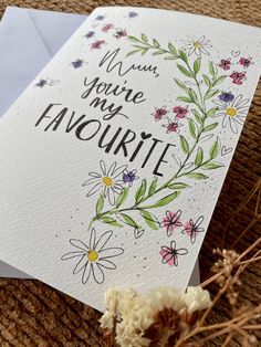 a card with the words you're my favorite surrounded by flowers