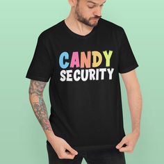 a man wearing a candy security t - shirt