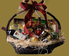 a basket filled with wine and snacks