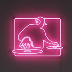 a neon sign with a man cooking on a pan in front of him and his hand holding a frying pan