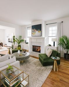 a living room filled with furniture and a fire place in the middle of a room