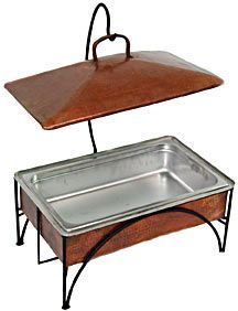 two serving trays on top of each other, one with a wooden lid and the other with metal legs