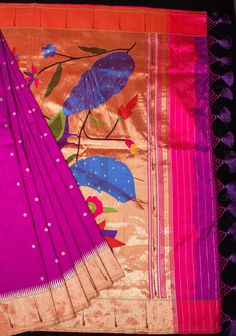 Paithani sarees are a quintessential part of Indian heritage, renowned for their exquisite craftsmanship and intricate designs. Originating from the town of Paithan in Maharashtra, India, these sarees are characterized by their rich silk fabric, vibrant colors, and ornate motifs This Fuchsia Hued saree comes with dainty buttas on the body and a Single Muniya Border that frames both edges. A gorgeous twin peacock design is featured in the pallu. Handwoven to beauty and opulence, this saree truly is a treasure to drape and own! SILK MARK CERTIFIED This saree is ready to wear with fall and pico done. Handmade silk tassels adorn the pallu and add more grace to it. An unstitched blouse fabric is included. *Note: There may be minor variations in the shade, the texture of the product. Hues/textur Luxury Paithani Silk Pre-draped Saree With Motifs, Yeola Paithani, Paithani Sarees, Silk Tassels, Indian Heritage, Peacock Design, Intricate Designs, Handloom Saree, Blouse Fabric