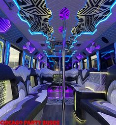 the interior of a party bus decorated in white and blue lights with black leather seats