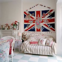 a living room with an union jack flag on the wall