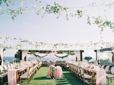 an outdoor wedding setup with tables and chairs