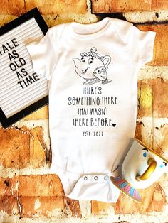 a baby bodysuit with the words there's something that was meant to me