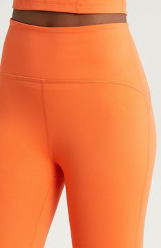 Sleek and stretchy fabric makes these high-waist leggings motion-friendly must-haves for the studio and beyond. 24" inseam; 7 1/2" leg opening; 11 3/4" front rise; 12 1/2" back rise (size Medium) Pull-on style 95% polyester, 5% elastane Machine wash, tumble dry Made in the USA of imported fabric Yoga Leggings With Contoured Waistband And Medium Support, Orange Compression Athleisure Activewear, Orange Compression Activewear Athleisure, Orange Compressive Athleisure Activewear, Orange Compression Activewear For Athleisure, Orange Compressive Activewear For Gym, Compressive Orange Activewear For Gym, Orange Compressive Activewear For Workouts, Orange Compression Activewear For Yoga