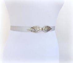 Women's silver elastic waist belt with silver leaf clasp by MissLaceAccessories on Etsy