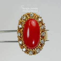 This beautiful oxtail red Coral Ring is set in 14k solid gold and a fancy diamond granulated setting! Ring Size: 7.25 Total Weight: 17.17 grams Precious Metal: 14k solid gold Precious stones: -Coral Center Stone: 20mm x 11mm -White Round diamonds: 0.4 ct Red Cluster Ring Stamped 14k, Red 14k Stamped Cluster Ring, Red 14k Gold Rings With Diamond Accents, Heirloom Red Oval Cluster Ring, Fine Jewelry Red Diamond Ring Stamped 14k, Oval Red Cluster Ring In 14k Gold, Red 14k Gold Diamond Ring With Accents, Red Diamond Ring With 14k Gold Accents, 14k Gold Red Diamond Ring With Accents