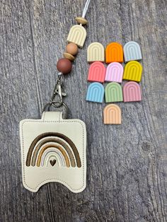 "Rainbow Teacher Classroom Doorbell Holder AND lanyard, Class Bell Case Key Chain, Class Lanyard Accessory, Teacher Gift, Teacher Appreciation Teachers, are you always looking for your doorbell fob?  Keep it within reach with this adorable doorbell holder, clipped right to your lanyard, or other item.  No need to remove it from the case to press the button, as you can easily press the button without removing it!  What a great gift for a teacher! Pair it with a doorbell for the perfect, thoughtful teacher gift! (They run about $15 online.) (Teachers use doorbells to get students' attention, etc. ) **Doorbells are not included** You received the doorbell holder AND the lanyard shown.  Please check the measurements of your fob to ensure it will fit. Cannot replace a custom-made, personalized Personalized Multicolor Badge Holders For Everyday Use, Personalized Multicolor Badge Holders, Classroom Doorbell, Wireless Doorbell, Online Teachers, Business Checks, Gift Teacher, Teacher Classroom, Vinyl Colors