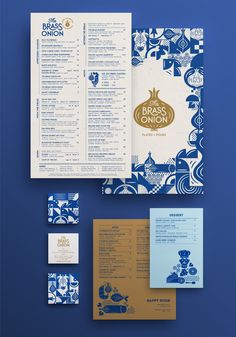 an assortment of stationery items including brochures, menus and envelopes