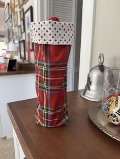 a red bag sitting on top of a wooden table