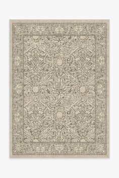 a beige rug with an intricate design on it