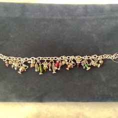 Brighton Multi Charm, With 15 Charms. Silver. 7 Inch With 1 Inch Extender. Elegant Multicolor Metal Charm Bracelet, Brighton Jewelry, Womens Jewelry Bracelets, Brighton, 1 Inch, Charm Bracelet, Charms, Women Jewelry, Bracelet