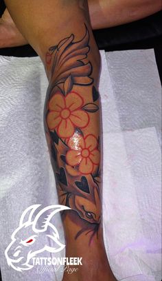 a woman's leg with flowers on it