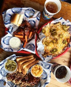 two baskets filled with food sitting on top of a wooden table